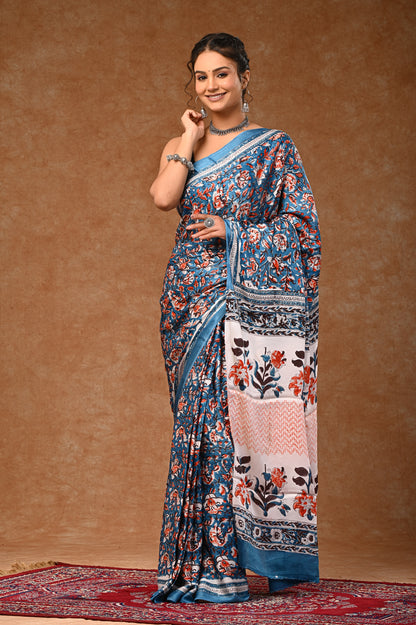Modal silk saree with attached blouse, adorned with traditional Sanganeri rapid hand block printing.