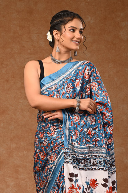 Modal silk saree with attached blouse, adorned with traditional Sanganeri rapid hand block printing.